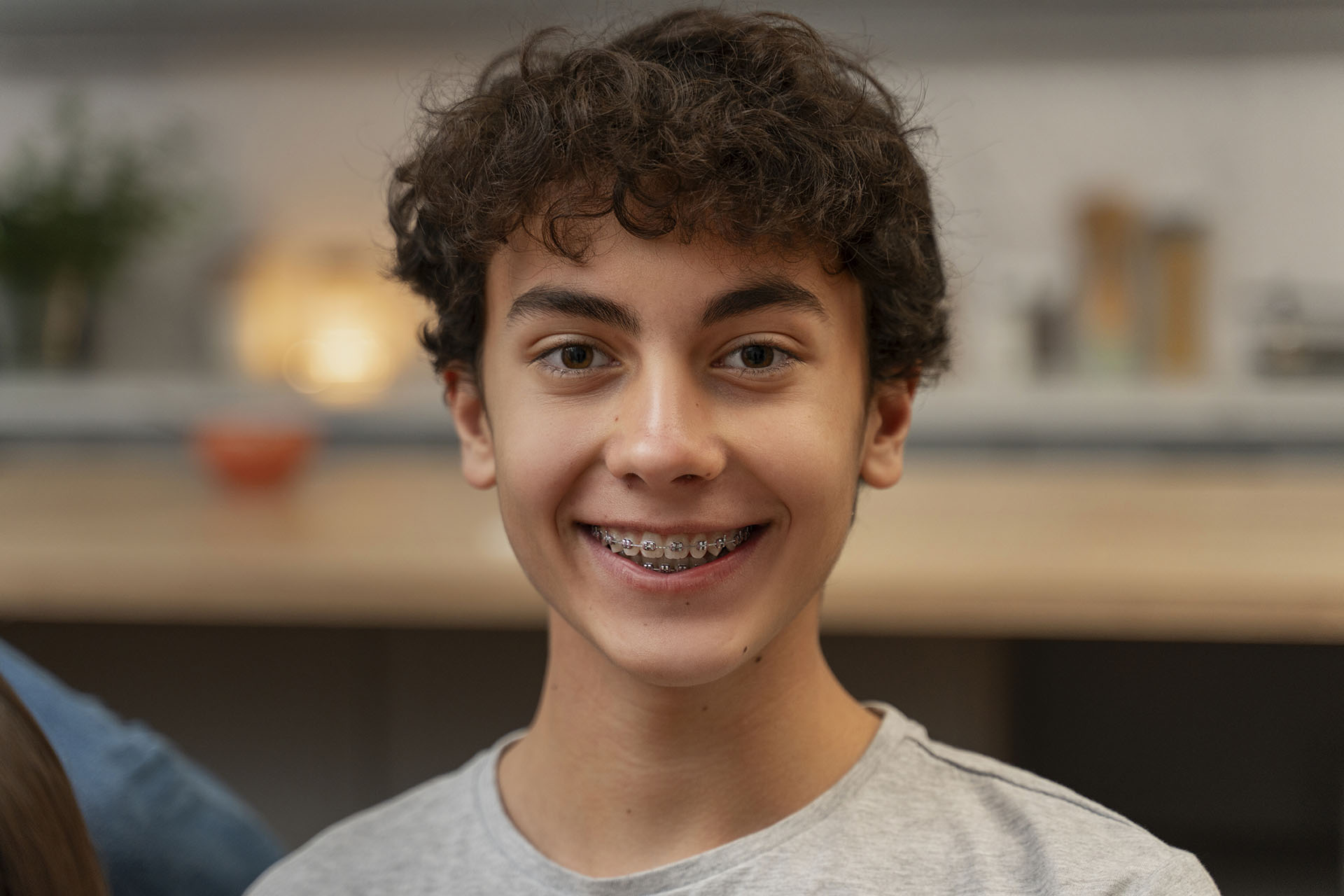 teenage boy wearing braces