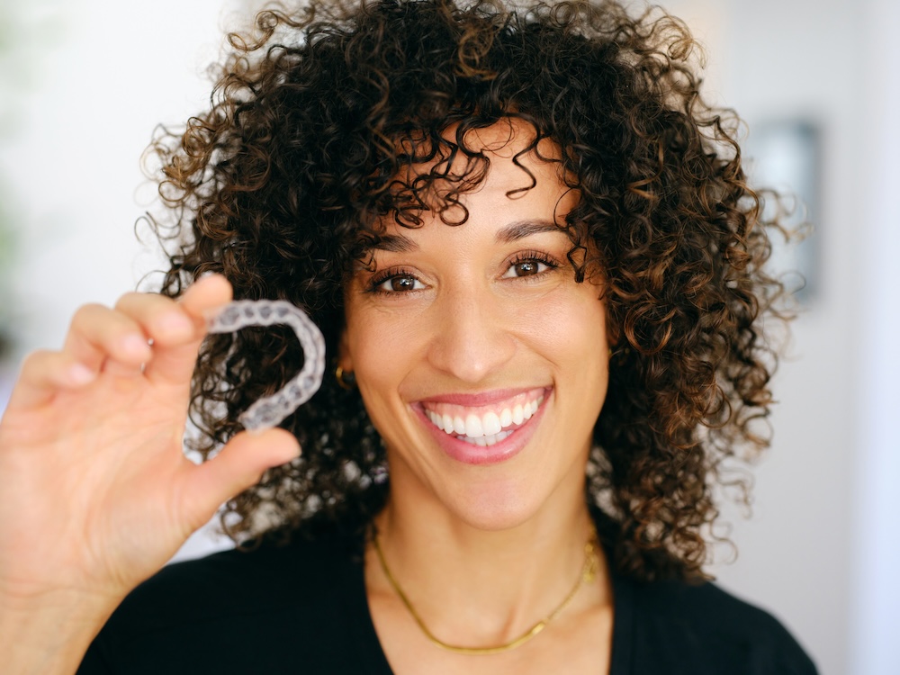 adult with aligners