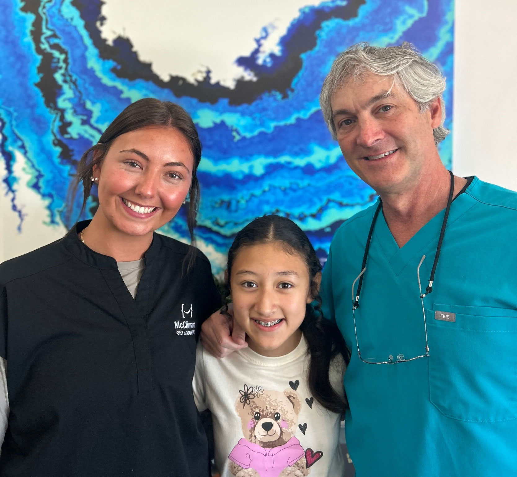 dr mcclimans, assistant, and child